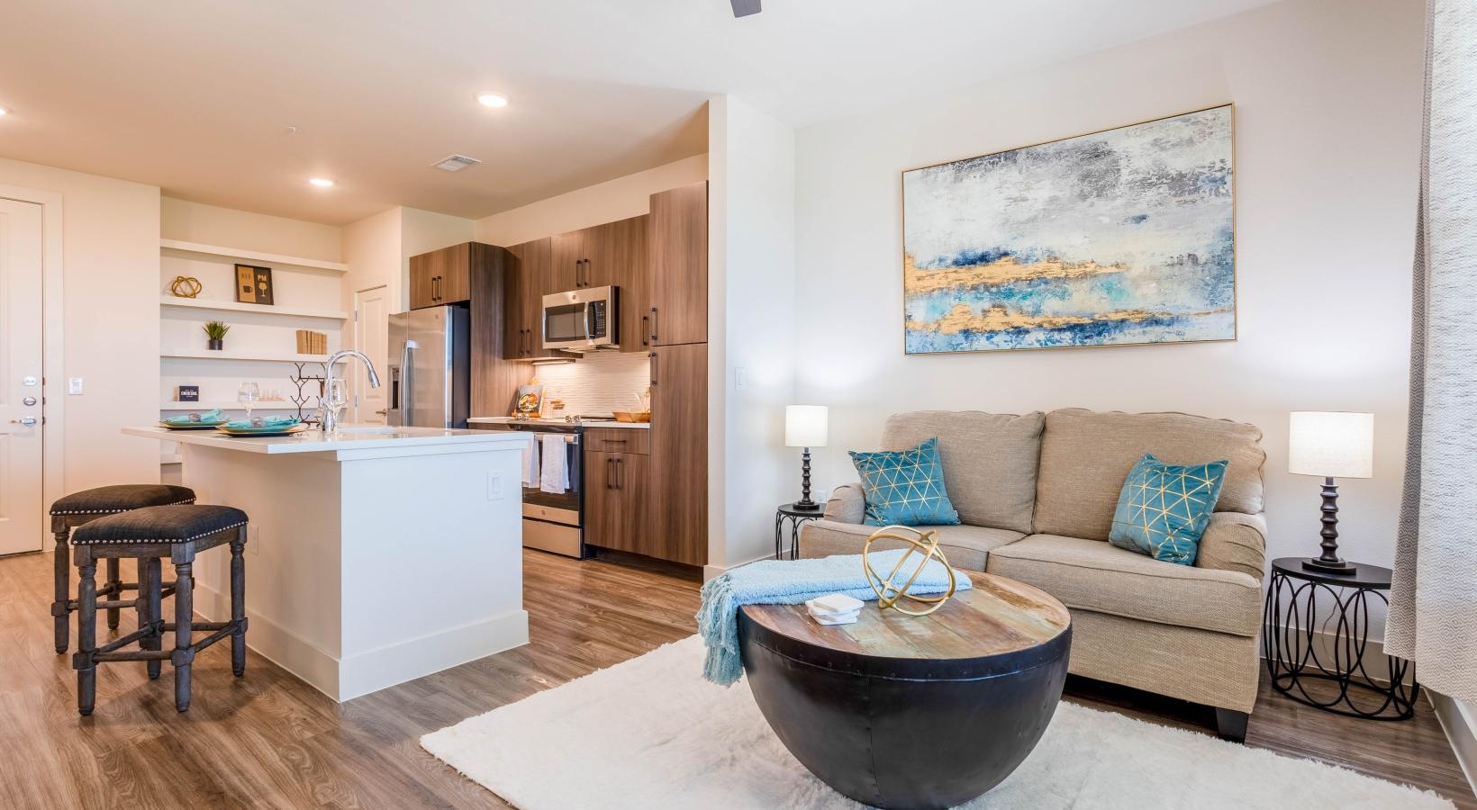 Bedroom options to fit every lifestyle a living room with a couch and a table