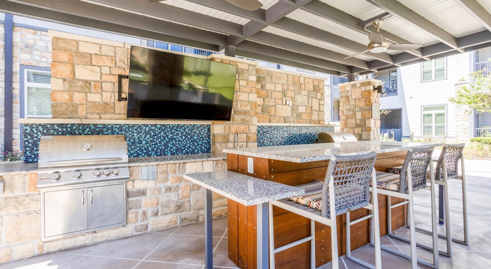 Find your perfect fit at Larkspur at Shadow Creek outdoor grills with a brick wall