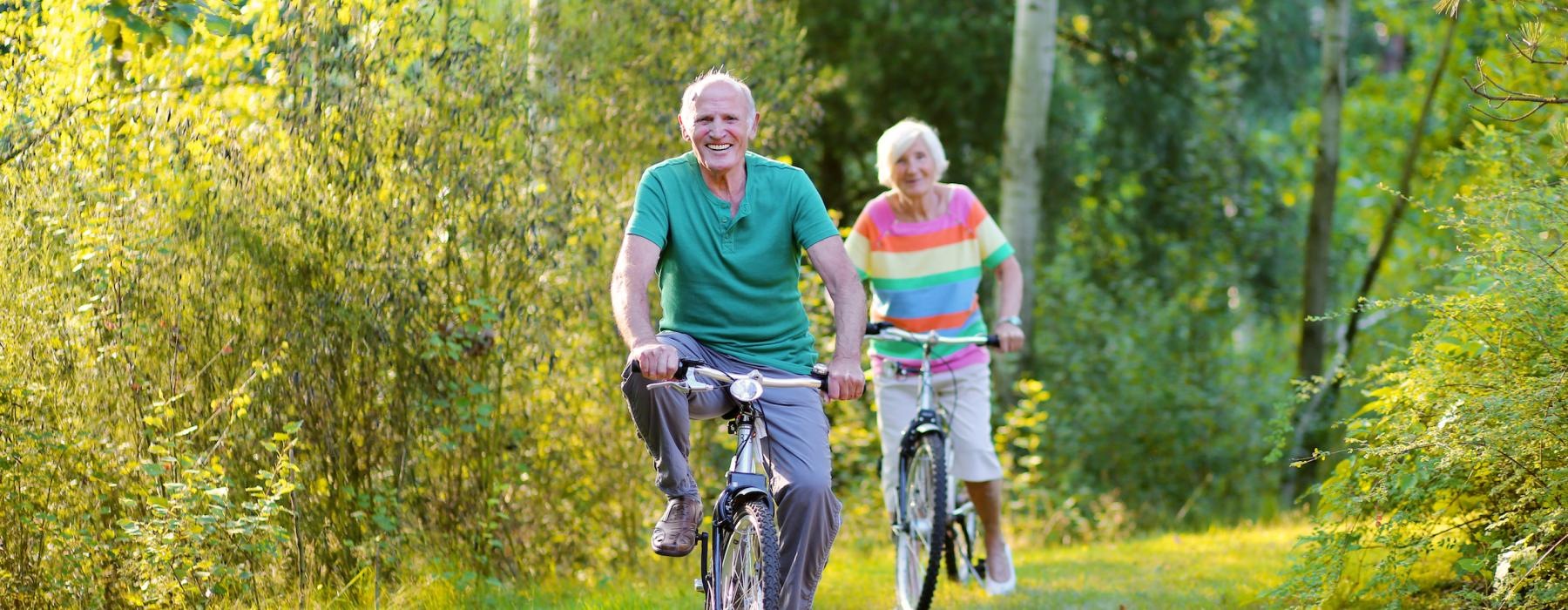 an older couple riding bicycles
