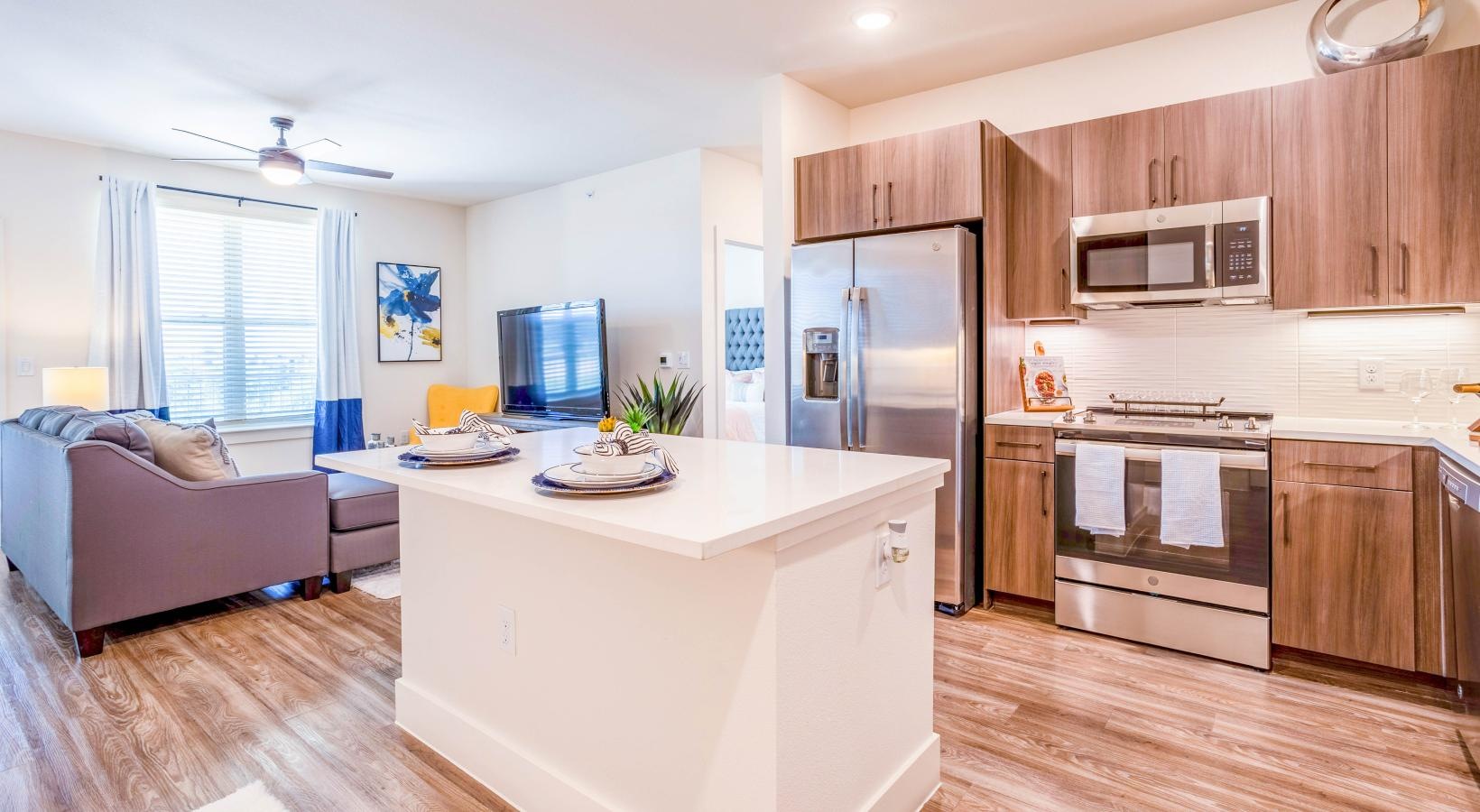 Spacious kitchens with thoughtful details a kitchen with a couch and a table