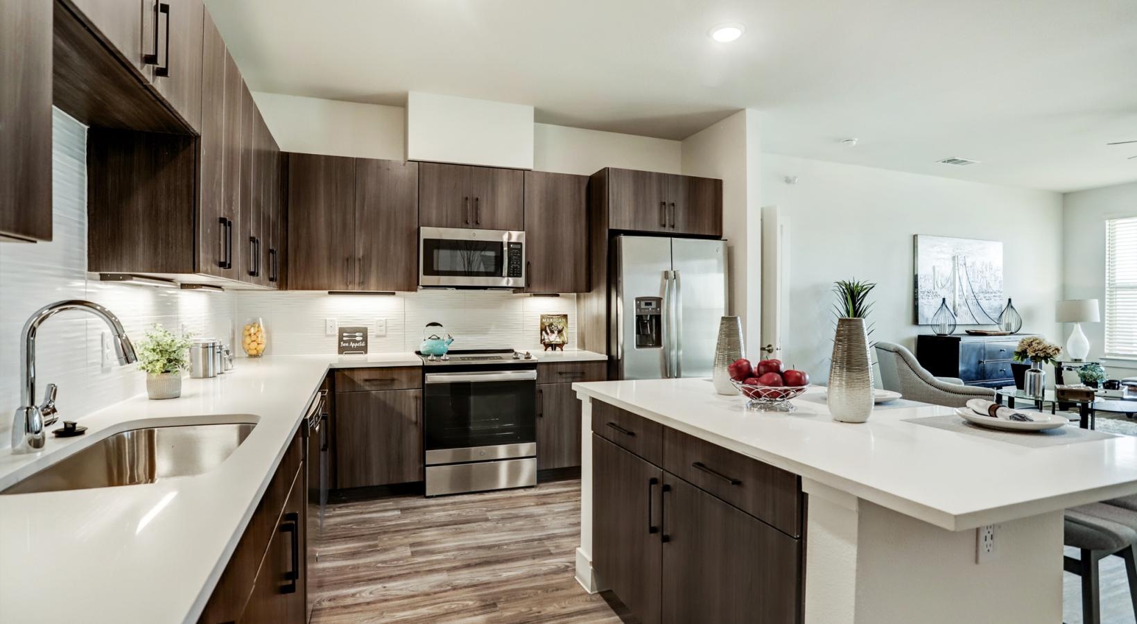 Spacious kitchens with thoughtful details a kitchen with wooden cabinets