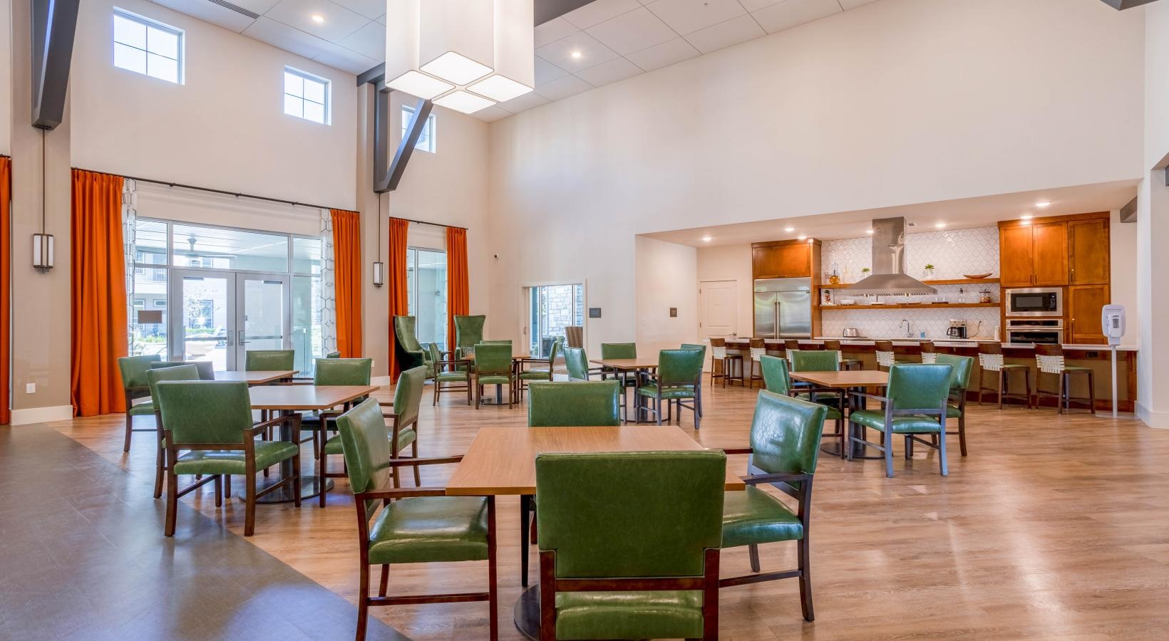 Enjoy our resident-only features a room with tables and chairs